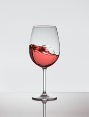 A glass of rose wine on the move