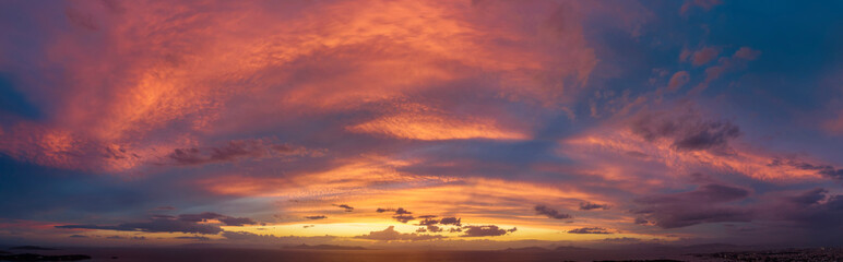 Panorama of a dramatic dusk sky over the ocean as background or texture