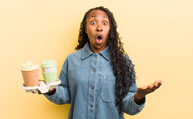 black pretty woman amazed, shocked and astonished with an unbelievable surprise