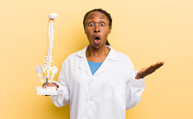 black pretty woman feeling extremely shocked and surprised