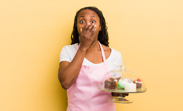 black pretty woman covering mouth with hands with a shocked