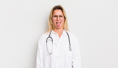 blonde pretty woman feeling disgusted and irritated and tongue out