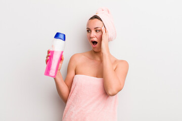 blonde pretty woman feeling happy, excited and surprised