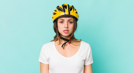 pretty woman looking very shocked or surprised