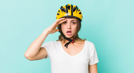 pretty woman looking happy, astonished and surprised