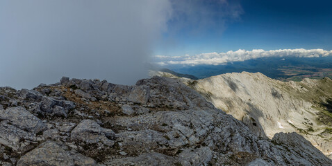 Koncheto ridge in Pirin mountains with fog at a side, Bulgaria