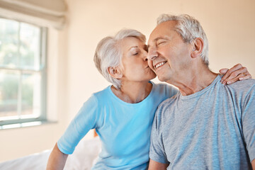 Youre the best. Cropped shot of an affectionate senior woman kissing her happy husband on the cheek in a nursing home.