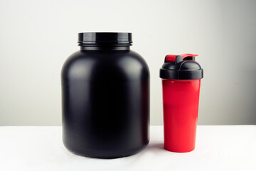 bodybuilding, healthy lifestyle concept. Whey protein powder and blender or shaker
