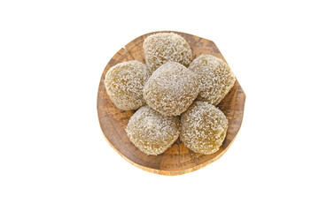 mochi cakes.Coconut mochi on a wooden board isolated on white background. Japanese dessert with coconut 
