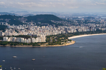 Fototapeta premium Aerial image of Botafogo and Flamengo cove and beach with its buildings, boats and landscape. Immensity of the city of Rio de Janeiro, Brazil in the background