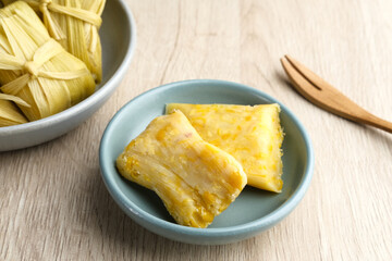 Lepet Jagung is a traditional Indonesian snack that is often found in Central Java, Indonesia, made from corn and grated coconut and wrapped in corn husks and steamed.
