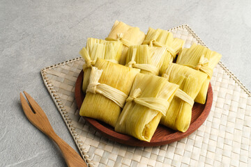 Lepet Jagung is a traditional Indonesian snack that is often found in Central Java, Indonesia, made from corn and grated coconut and wrapped in corn husks and steamed.
