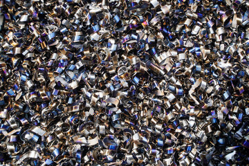 Rusty scrap metal shavings swirls in blue tone.Steel scrap materials recycling. 
