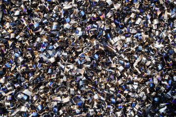 Rusty scrap metal shavings swirls in blue tone.Steel scrap materials recycling. 
