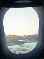 inside the plane, looking through a window