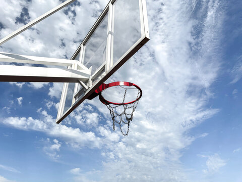 basketball court, a basket ring hoop against the sky