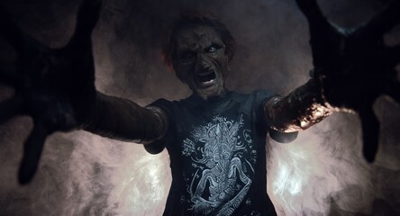 scary sorcerer in smoke. voodoo rite