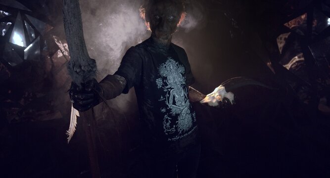 scary sorcerer in smoke. voodoo rite
