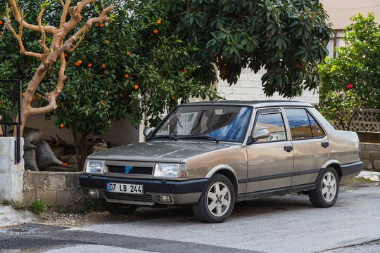 Side, Turkey -February  20, 2022:   gray  Tofas  Dogan  is parked  on the street on a warm  day