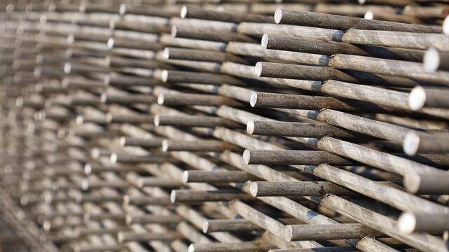 Wire mesh steel grid. Close-up of BRC welded wire mesh for slab construction with natural light on the side view. Selective focus