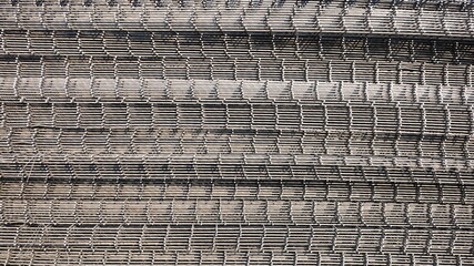 Steel wire mesh pile background. Wire mesh for outdoor concreting. Selective focus
