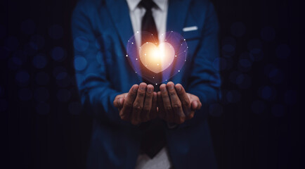 hands holding digital heart on visual screen , health care, love, organ donation,world heart day,...