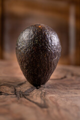 Ripe avocado isolated on wooden background 