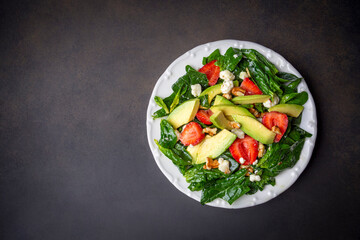 Healthy diet salad; Strawberry Spinach Salad with Avocado.