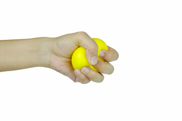 Hands of man with a gentle personality He exhibits stressful behavior from work, and he squeezes the yellow ball expressing emotion, anger, displeasure. Medical concepts and emotional regulation