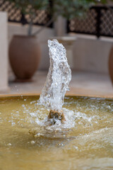 a small fountain works in the summer in the garden