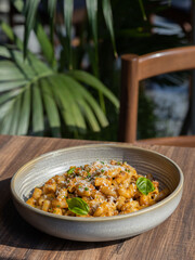 Poke bowls and other gourmet foods, with drinks and sushi on the table,