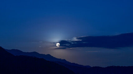 landscape with beautiful moon illuminating the lake of Valle de Bravo in Mexico