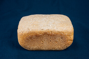 The freshly baked bread on a black background close-up. Making bread. Top view.