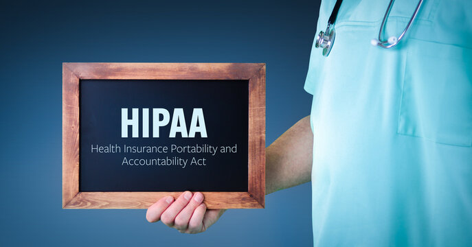 HIPAA (Health Insurance Portability and Accountability Act). Doctor shows sign/board with wooden frame. Background blue