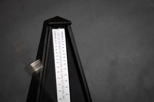 Metronome in action isolated and on a plain background