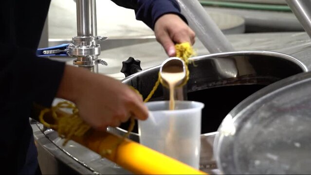 Pouring tequila fermentation in Tequila, Jalisco