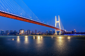 Fototapeta na wymiar Asphalt road platform and bridge with city skyline in Shanghai, China.