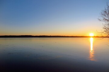 Obraz premium sunset over the river