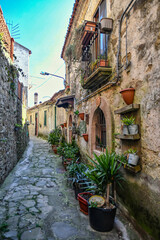 Fototapeta na wymiar A narrow street among the old stone houses of Rocca Cilento, town in Salerno province, Italy.