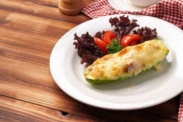 Big mussel baked with cheese on white plate