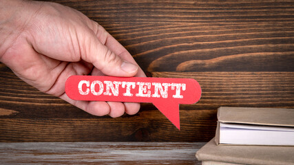 Content. Red speech bubble in a man's hand