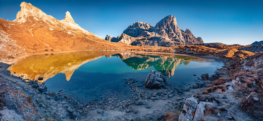 Schusterplatte peak reflected in the Calm waters of Piani lake. Panoramic autumn view of Dolomite alps. Gorgeous morning scene of Tre Cime Di Laveredo National Park, Italy, Europe.