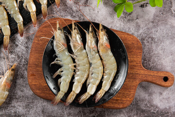 fresh raw white shrimps or prawns on table