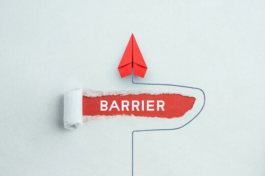 Concept of overcoming barriers, goal, target. Red paper plane