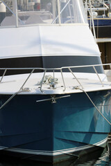 Fototapeta premium Large cruiser boat sitting in the marina, on a warm sunny day.