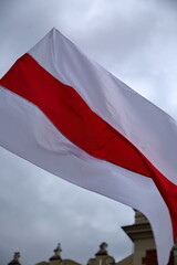 Original flag of Belarus used by political opposition waves against sky