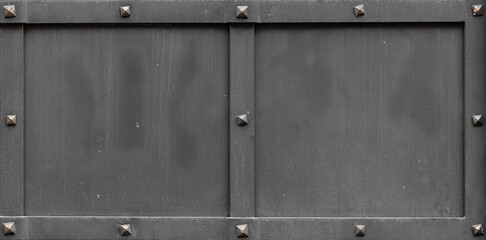 Grunge background steel metal black color with forged perimeter strip, riveted metal surface