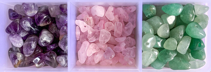 amethyst crystals, green aventurine, rose quartz on white background.