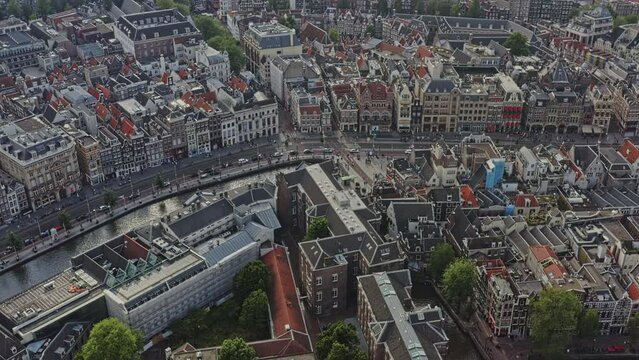Amsterdam Netherlands Aerial v32 high angle birds eye view drone fly across de wallen, binnenstad and negen straatjes neighborhoods capturing rows of dutch houses and properties - August 2021