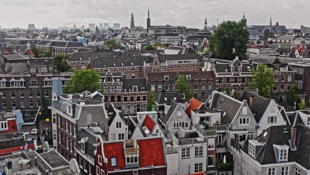Amsterdam Netherlands Aerial v41 low level flyover neighborhoods of nieuwmarkt en lastage, de wallen and binnenstad, capturing little narrow canal houses at historic urban center - August 2021